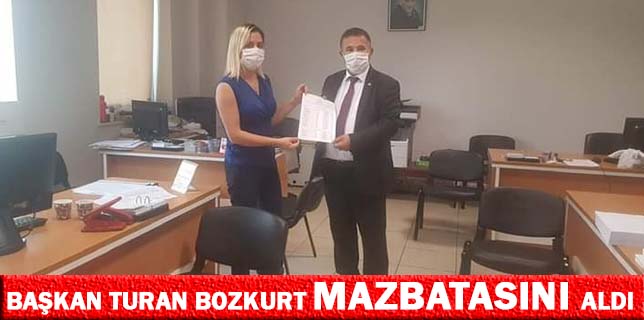 MHP İLÇE BAŞKANI TURAN BOZKURT MAZBATASINI ALDI